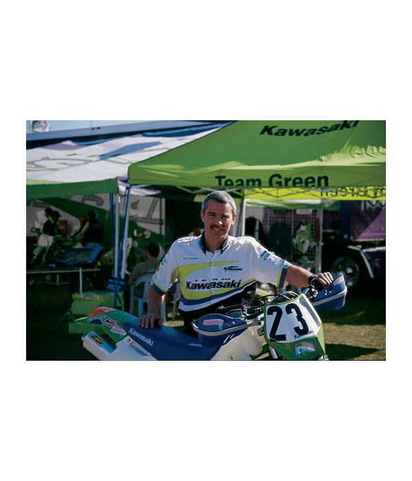 Jeff Fredette posing behind a motorcyle during the AMA Motorcycle event.