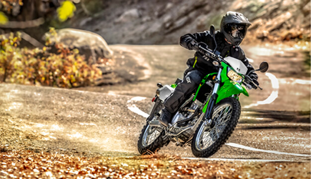 Rider on a motorcycle riding down the road